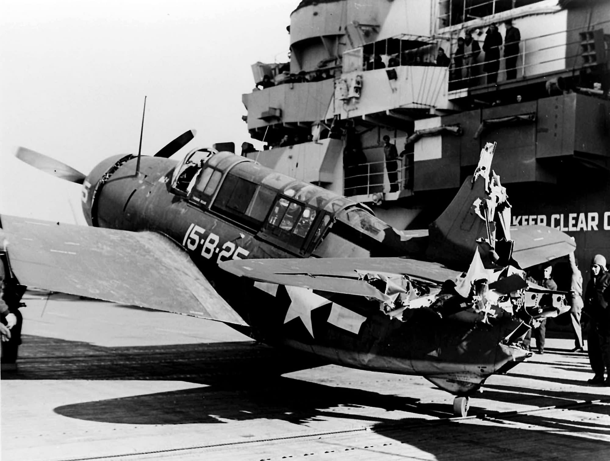 Damaged Curtiss SB2C Helldiver 15-B-25 of VB-15 on the flight deck of the aircraft carrier USS Hornet (CV-12) – 2 January 1944