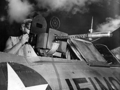 Rear gunner mans machine gun on SBC BuNo 1843 coded 151-MO-9 of the VMO-151