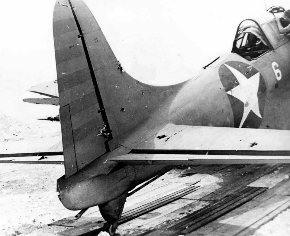 SBD-2 white 6 BuNo 2106 at Midway with over 200 holes in it