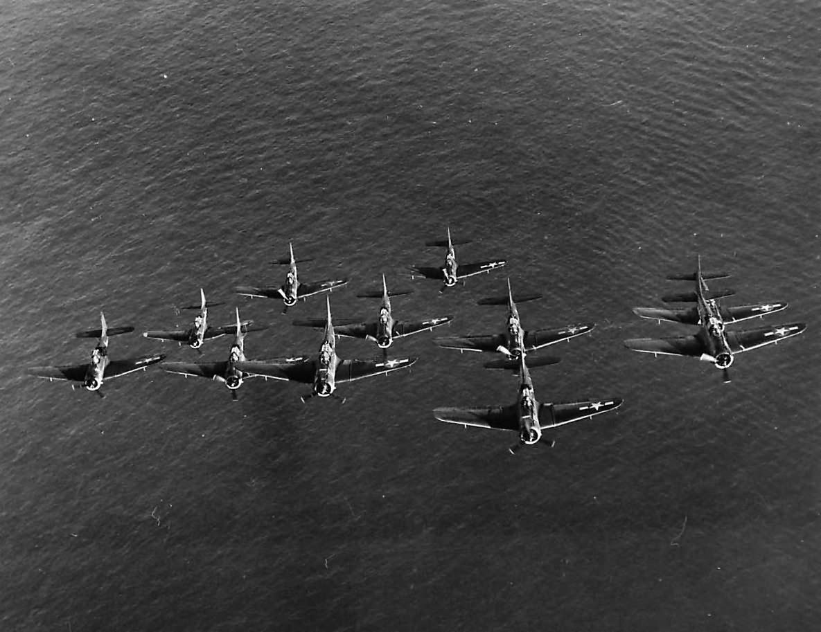 SBD-5 from VB-10 fly in formation near their carrier USS Enterprise 44