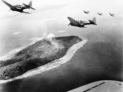 SBD-5 from VB-16 off the carrier Lexington (CV-16) fly low over Japanese installations on Param Island Truk Atoll on April 29, 1944