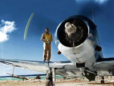 Capt. John F. Adams, USMC on the wing of his SBD