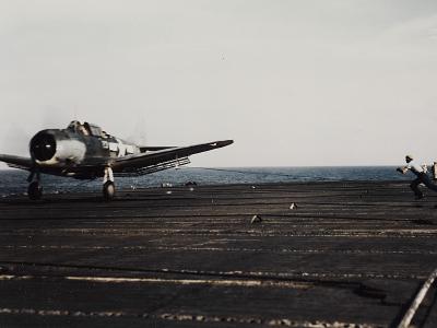 SBD Dauntless lands on USS Lexington (CV-16) during the Marshalls and Gilberts Operation in November 1943
