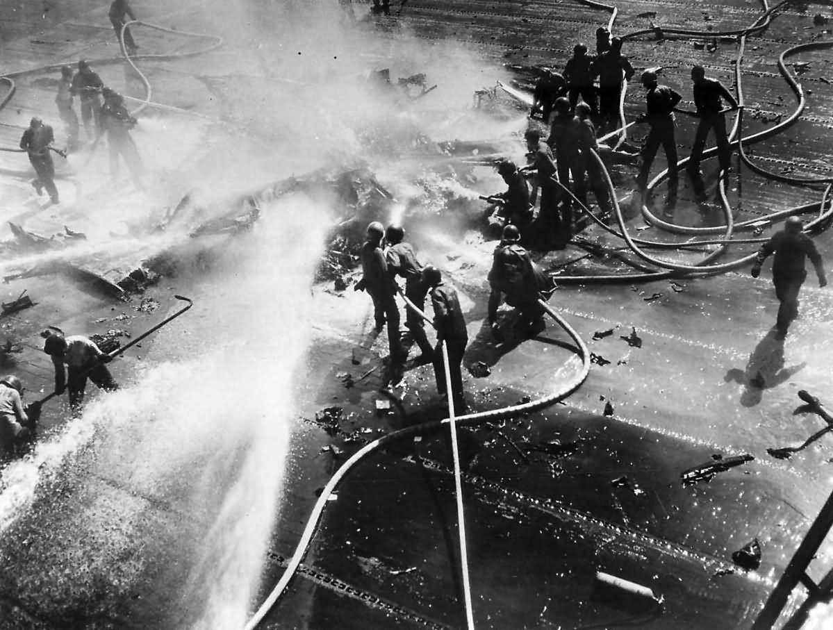 Crew Fight Fire of Burning TBM Avenger piloted by Lt. C.R. Dean of VT-124 on Deck of USS HANCOCK (CV-19) – 21 January 1945