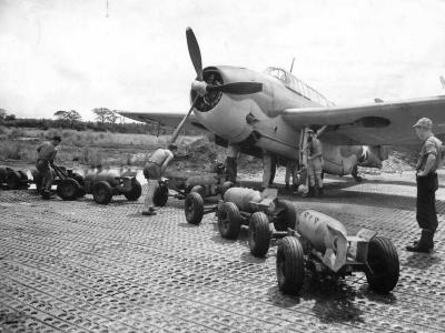Crew loads 500 lb bombs on TBF at Guadalcanals Henderson Field