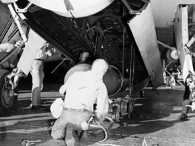 Loading a Mark XIII torpedo into the bomb bay of a TBF-1 USS Lexington 2