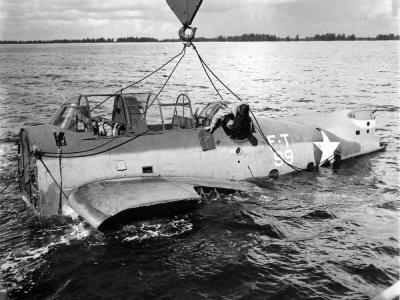 Students begin to extricate themselves from the fuselage of a TBF