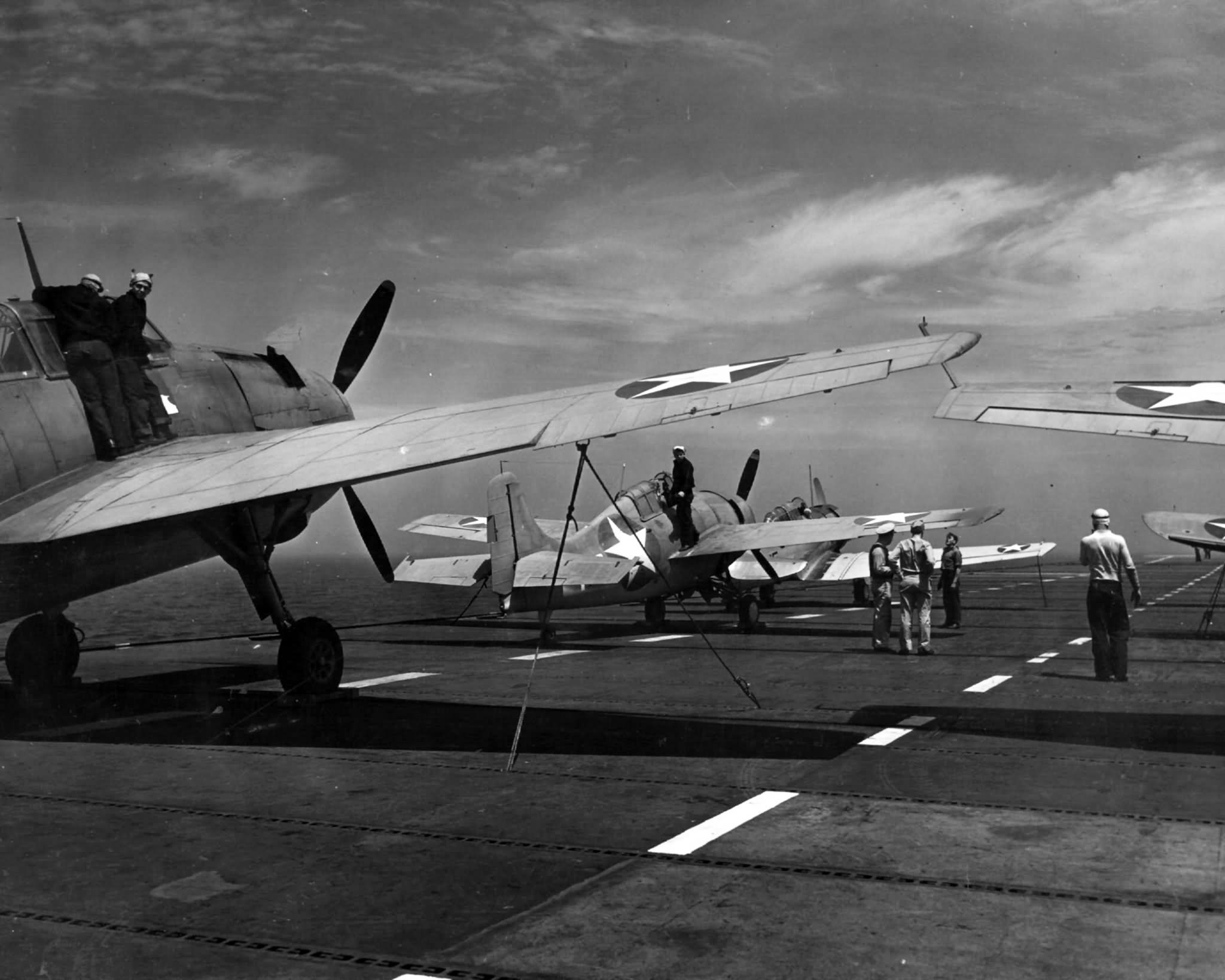 TBF Avenger, F4F Wildcat and an SNJ Texan on deck of USS Sable (IX-81) – June 10, 1943