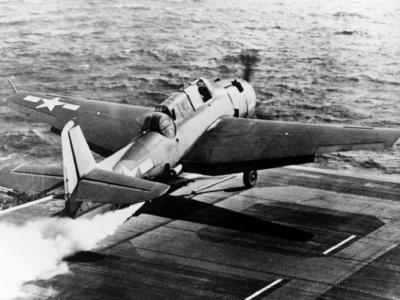 TBF take off with JATO USS Makassar Strait (CVE-91)