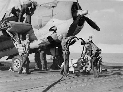 refuel a TBF-1 Avenger of VT-4 on the flight deck of the USS Ranger during Operation Torch November 8 1942