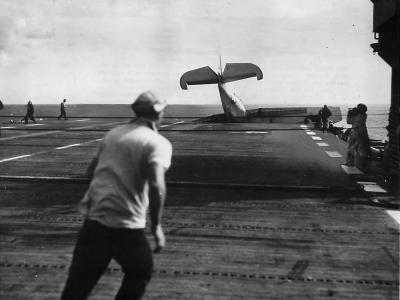 Pilot of TBF misses barrier on his aircraft carrier