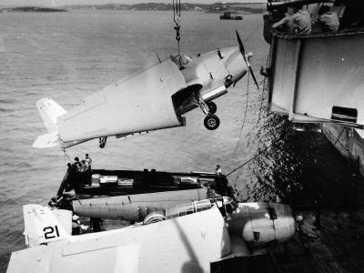 Replacement TBM being hoisted on board USS Guadalcanal while at Bermuda 10 August 1944