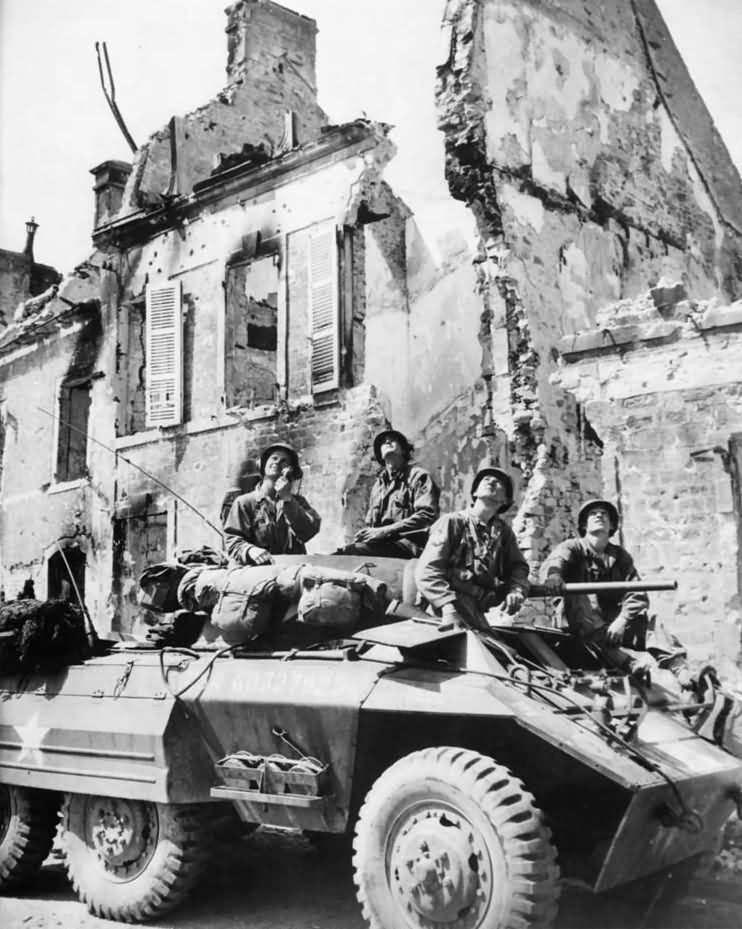 US Soldiers of Recon Unit in M8 Scout Car In Mountebourg France