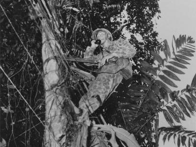 Marine lays telephone wire