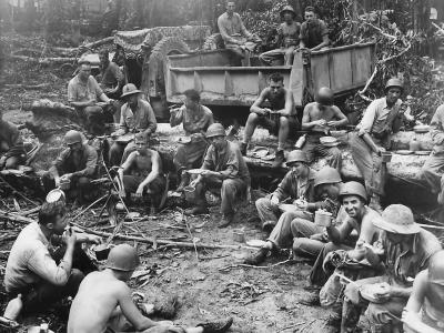 Marines of the 19th Engineers and Navy Seabees break for chow