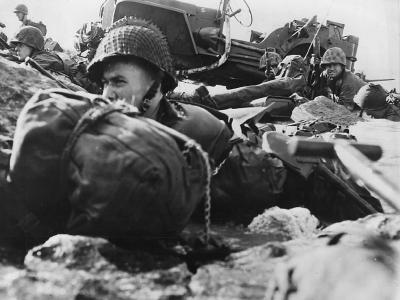 Marines Crouch on Beach during Invasion of Eniwetok
