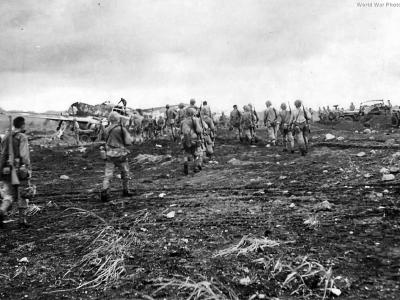 Marine and wrecked Japanese plane at Cape Gloucester Airport