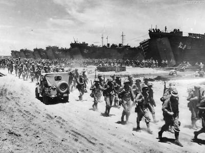 Marines disembark from LSTs on Cape Gloucester