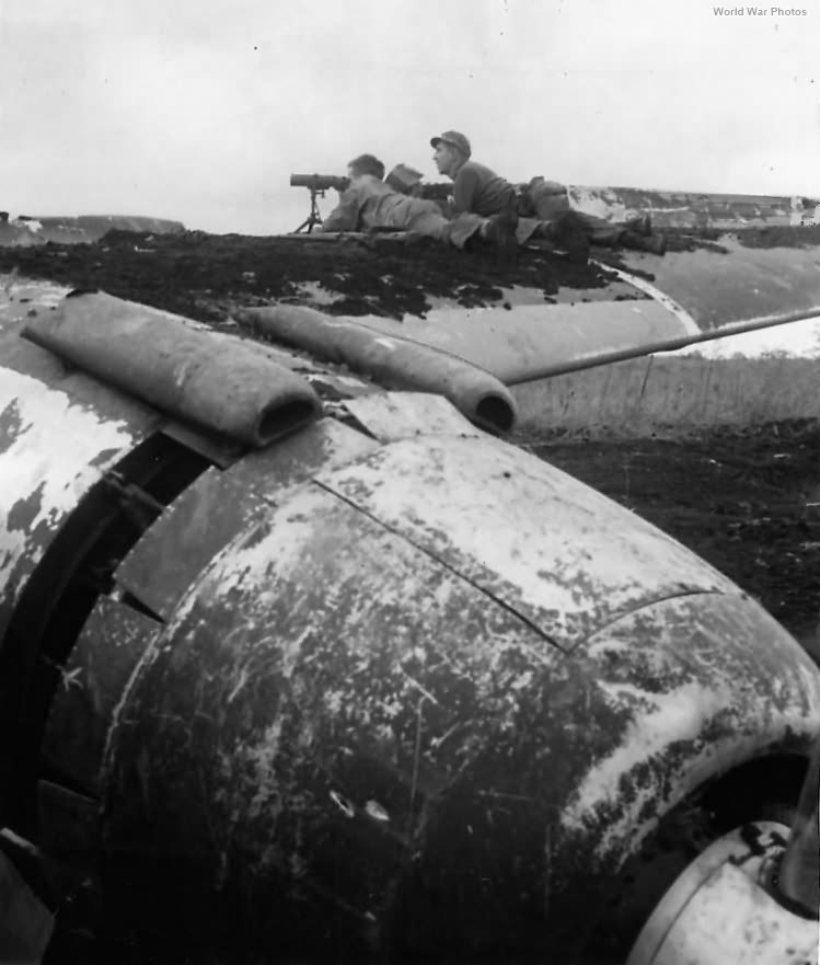 Marines man rangefinder on Wing of Japanese plane on Cape Gloucester