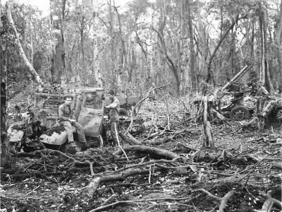 Marines with wrecked Japanese equipment on Cape Gloucester