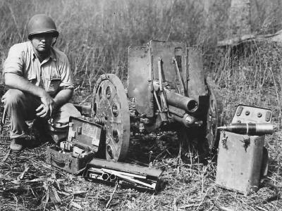 Marine with captured Japanese Type 92 70 mm light howitzer Guadalcanal 1942