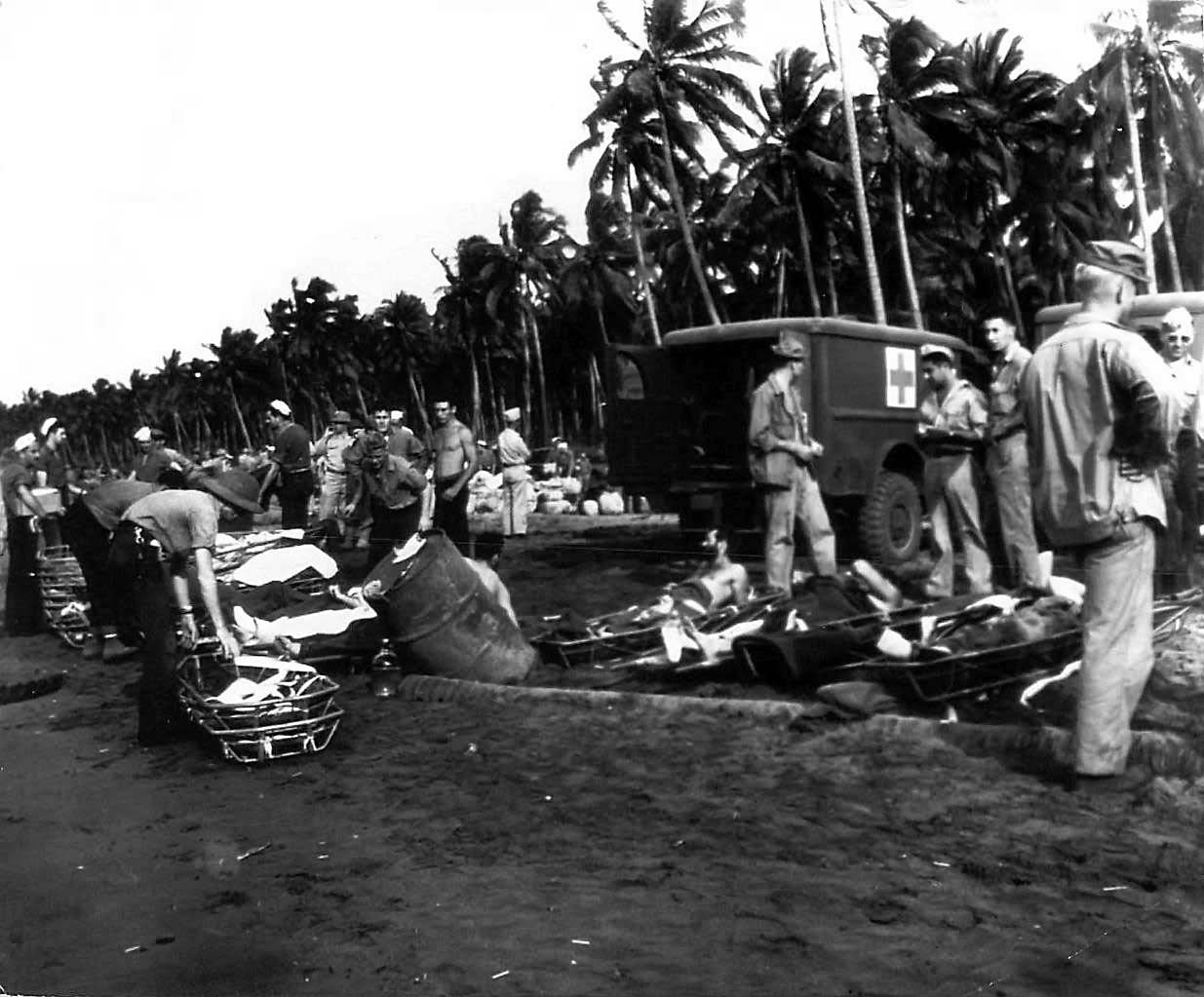 Wounded Troops Await Transport On Guadalcanal Beach 1943 | World War Photos