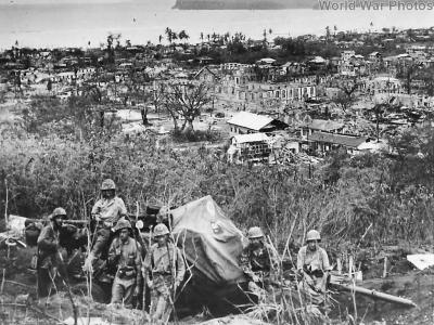 Gun crew amid ruins of Agana