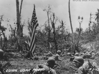 Marines and U.S. flag on Guam July 1944