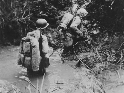 Marines crossing stream