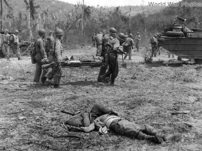 Marines pass fallen Japanese soldier near Asan Point