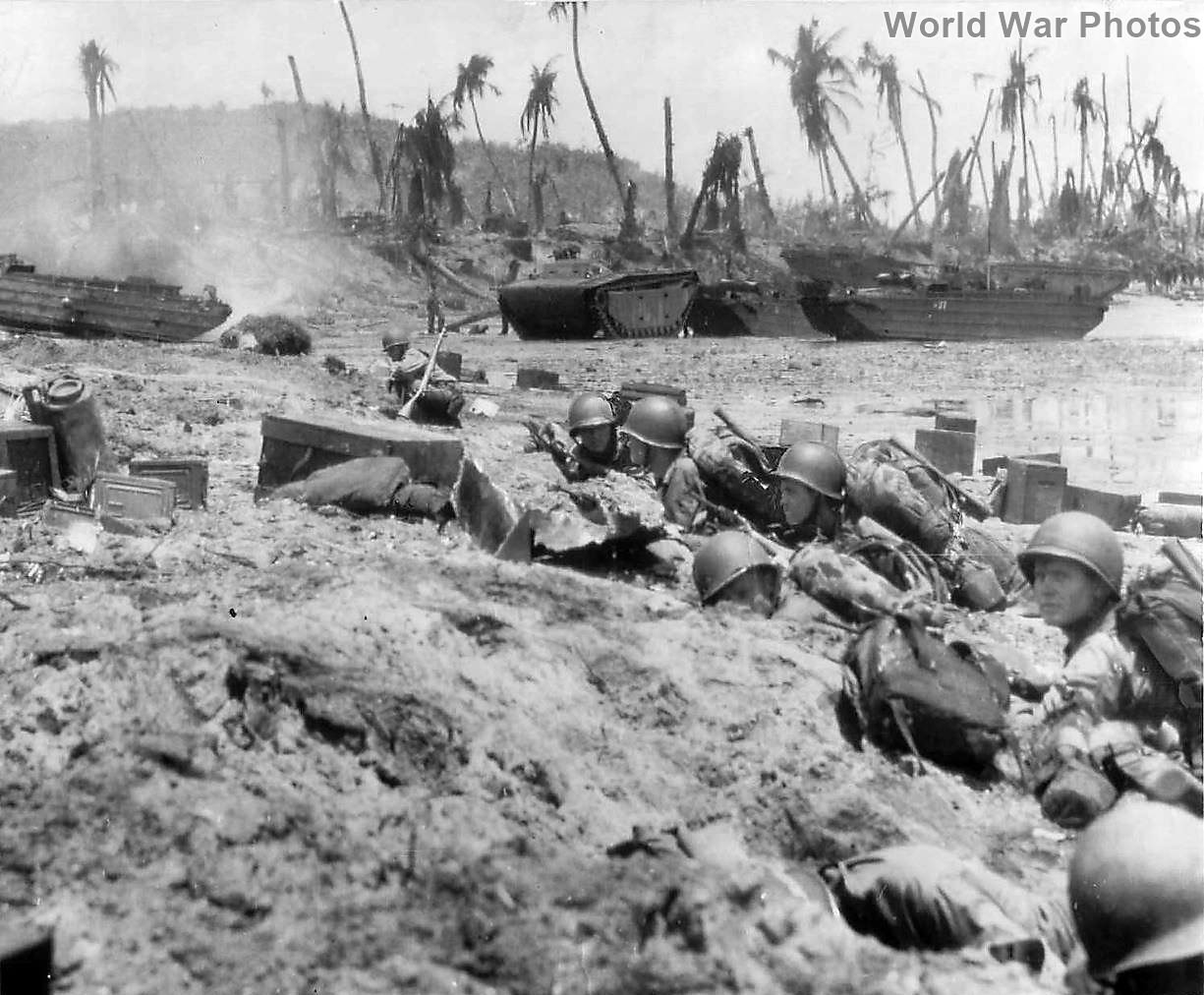 Marines shelter on beach during Invasion of Guam | World War Photos