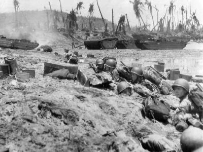 Marines shelter on beach during Invasion of Guam