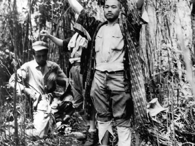 3 Japanese being captured during battle