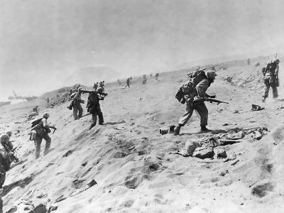 4th Division Marines move up beach on Iwo Jima