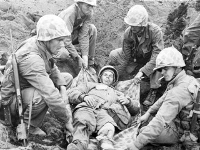 Iwo Jima moving wounded Marine