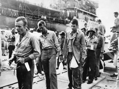 Marines wounded on Iwo Jima arrive at Marianas Base