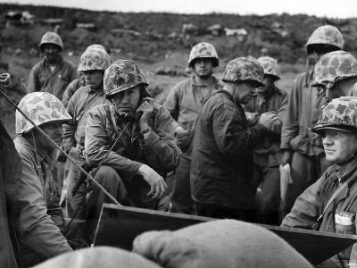 Officers of the 5th Marine Div direct operations from a sandbagged position