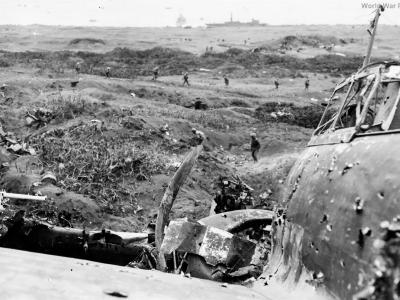 23rd Marines clear pillbox by wrecked A6M5
