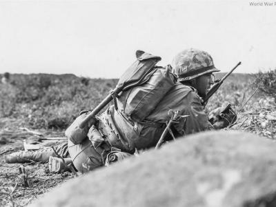 3/21 Marines crawling forward under fire at Airfield 2 Iwo Jima 24 February 1945
