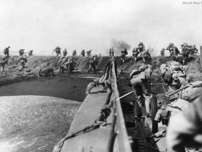 4th Marines pour ashore from LCVP at Iwo Jima