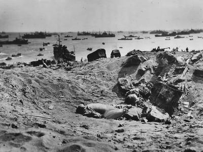 Dead Japanese lie in a shell hole on the ashy slopes below Mt Suribachi