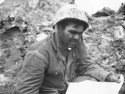 Marine studies map during fighting on Iwo Jima