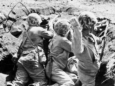 Marine Throws Grenade on Iwo Jima February 1945