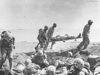 Medics carry wounded Marine on Iwo Jima