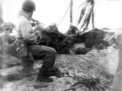 4th Div Marines work to coax Japanese from pillbox on Namur