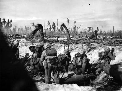 4th Division Marines scan the front on blasted Roi Namur Island