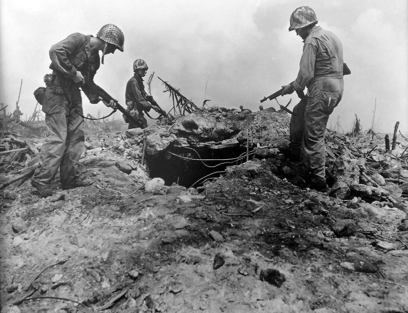 Troops inspect a bunker after capturing the Kwajalein