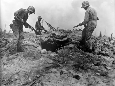 Troops inspect a bunker after capturing the Kwajalein