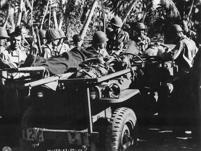Litter bearing Jeep carries wounded from combat area on Makin