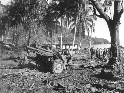 Allied troops set up M2A1 105mm howitzer in Depapre New Guinea 1944